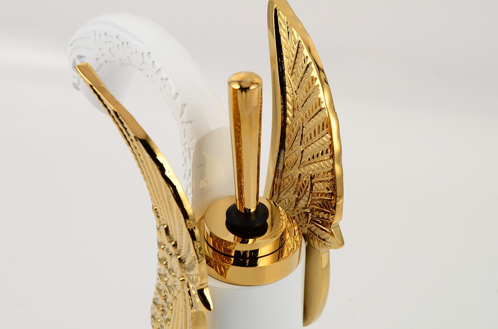 gold and white single lever bathroom sink faucet